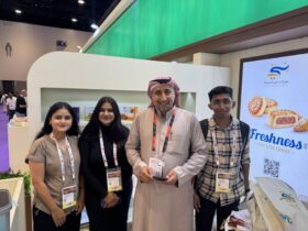 Aniket Moon and Fortune Path Academy students in formal attire attending the Gulf Food Exhibition in Dubai for practical international trade networking.