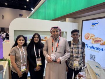 Aniket Moon and Fortune Path Academy students in formal attire attending the Gulf Food Exhibition in Dubai for practical international trade networking.
